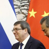 Chinese Foreign Affairs Minister Wang Yi and Cuban Foreign Minister Bruno Rodriguez leave after a news conference at Diaoyutai state guesthouse on May 29, 2019 in Beijing, China.