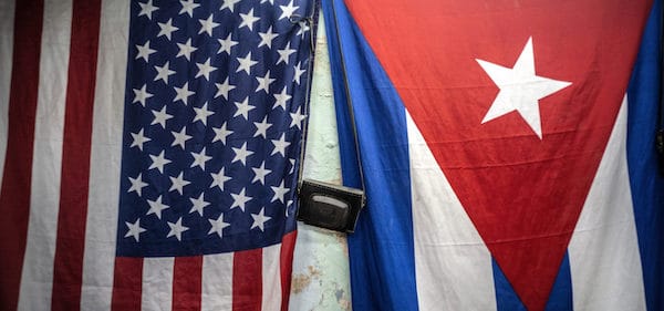 | US and Cuban flags hang from a wall with an old photo camera hung in between in Havana Cuba Monday Jan 11 2021 Ramon Espinosa | AP | MR Online