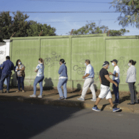 Voters wait in line during general elections in Managua, Nicaragua, Nov. 7, 2021.