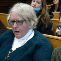 From left: Kariann Swart, Joseph Rosenbaum's fiancee, Susan Hughes, Anthony Huber's great aunt, and Hannah Gittings, Anthony Huber's girlfriend, listen as Kyle Rittenhouse is found not guilty of murder at the Kenosha County Courthouse on November 19, 2021.