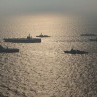 Ships from the Royal Australian Navy, Japan Maritime Self-Defense Force, Indian Navy and the United States Navy participate in Malabar 2020, a multilateral war-gaming naval exercise that began in 1992. US Navy photo by Mass Communication Specialist 3rd Class Elliot Schaudt/Flickr.