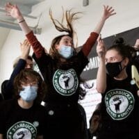 Starbucks workers in Buffalo, New York after learning that they are the first to unionize in the country.