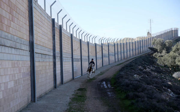 | A PALESTINIAN BOY RIDES A HORSE NEAR THE SEPARATION WALL DURING AN EQUESTRIAN TRAINING AT THE PALESTINIAN EQUESTRIAN CLUB IN RAFAT NEAR JERUSALEM ON FEBRUARY 3 2019 PHOTO SHADI JARARAHAPA IMAGES | MR Online