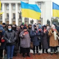 Protesters on February 10 holding signs that read, “No war with Russia”