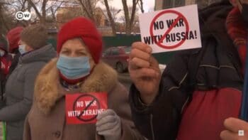 | Protesters holding signs that read No war with Russia right and No war with Ukraine | MR Online