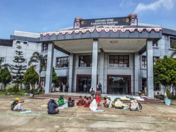 | Protestors wait outside a West Papuan court in February 2021 during the trial of Johny Kamuru head of Sorong Regency Kamuru was being sued by palm oil companies after revoking their permits to plant on land claimed by indigenous groups Moves like this to protect ancestral land against big agribusiness are rare in Indonesia In this case the court ruled in favour of Kamurua landmark victory for indigenous groups But the companies are expected to continue their legal battle | MR Online