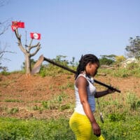 Sbongile Tabhethe works in the food garden at eKhenana land occupation in Cato Manor, Durban, 9 June 2020. Credit: New Frame / Mlungisi Mbele