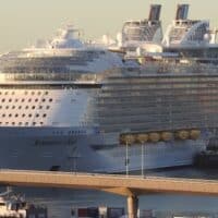 Symphony of the Seas, an Oasis-class cruise ship owned and operated by Royal Caribbean International. It was the largest cruise ship in the world by gross tonnage when built in 2018. Photo by roli_B/Flickr.