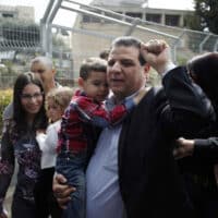 AYMAN ODEH, HEAD OF THE HADASH PARTY, VOTES DURING THE 2015 ISRAELI NATIONAL ELECTIONS. (PHOTO: MUAMMAR AWAD/APA IMAGES)