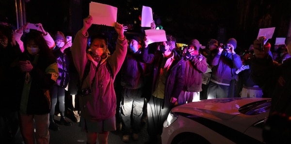 | Protesters hold up blank papers and chant slogans as they march in protest in Beijing Sunday November 27 2022 | MR Online