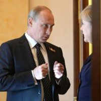 Russian President Vladimir Putin with then German Chancellor Angela Merkel on May 10, 2015, at the Kremlin. (Russian Government)