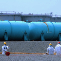 “Workers at TEPCO's Fukushima Daiichi Nuclear Power Station work among underground water storage pools on 17 April 2013. Two types of above-ground storage tanks rise in the background.” Photo from International Atomic Energy Agency (IAEA) official Flickr account, edited from original. Photo Credit: Greg Webb / IAEA. Image license: Attribution 2.0 Generic (CC BY 2.0)