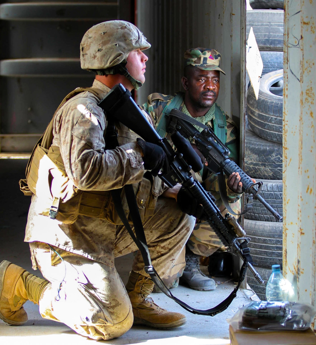 | A US Army rifleman pulls security with a Ghanaian soldier during a training exercise near Camp Thies Senegal in 2014 Photo | US Army | MR Online