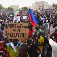 | Nigeriens participate in a march called by supporters of coup leader Gen Abdourahmane Tchiani in Niamey Niger July 30 2023 Poster reads Down with France long live Putin | MR Online