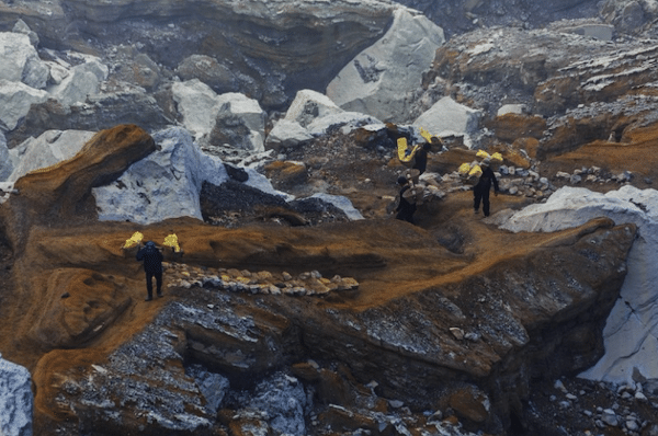 | Indonesian sulfur miners carrying their 90 kilogram loads of sulfur from the floor of the volcano to crater rim Ijen Volcano Banyuwangi Regency East Java February 9 2015 Photo by Uwe AranasCEPhotoFlickr | MR Online