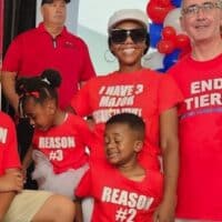 | Kiada Shanklin center a team leader in the quality department at Stellantiss Jeep Grand Cherokee plant posed with her three children and UAW President Shawn Fain at a contract rally on Sunday in Warren Michigan Her shirt says I have 3 major reasons to strike Photo UAW | MR Online