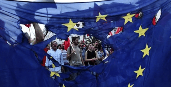 | e People protesting in Greece with a torn Europe Union flag during protests against neoliberal austerity measures in 2015 Photo APFile photo | MR Online