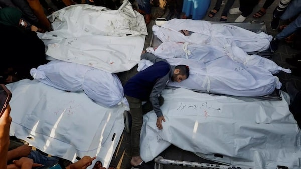 | A mourner reacts amidst the bodies as people attend funeral for Palestinians killed in Israeli strikes in Khan Younis southern Gaza Strip on 24 October 2023 Reuters | MR Online