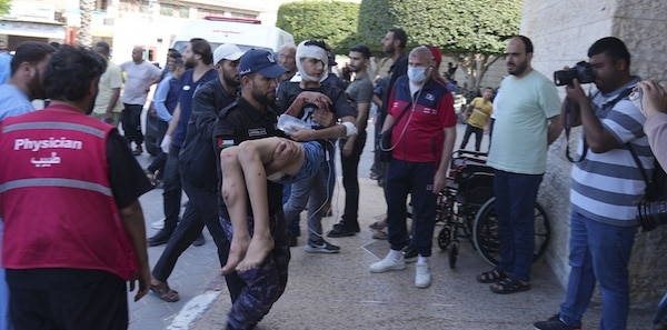 | Palestinians wounded in Israeli airstrikes are brought to a hospital in Deir al Balah south of the Gaza Strip October 15 2023 | MR Online