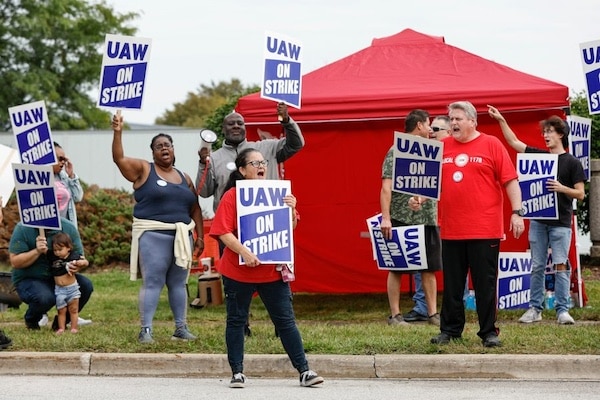 | UAW members and workers at the Mopar Parts Center Line in Center Line Michigan hold signs outside the facility after walking off their jobs at noon on September 22 2023 PHOTO BY KAMIL KRZACZYNSKI AFP | MR Online