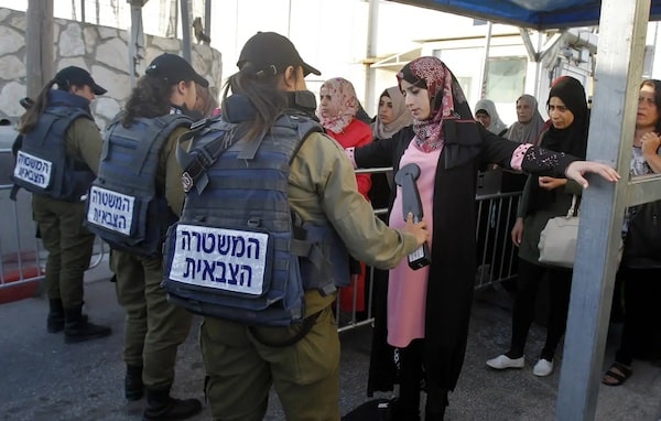 | Palestinians pass through an Israeli checkpoint between Bethlehem and Jerusalem in the occupied West Bank Photo Getty imagesFile photo | MR Online