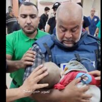 | Palestinian journalist Wael Dahdouh cradles his child killed by Israel while he was on air October 27 | MR Online