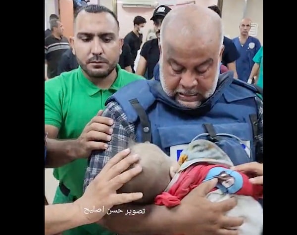 | Palestinian journalist Wael Dahdouh cradles his child killed by Israel while he was on air October 27 | MR Online