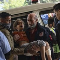 A Palestinian girl wounded in Israeli bombardment of the Gaza Strip is brought to a hospital in Khan Younis, Friday, Dec. 1, 2023.