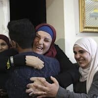 | Israa Jaabis center a Palestinian prisoner released by Israel is hugged by relatives as she arrived home in East Jerusalem Nov 26 2023 | MR Online