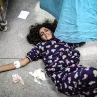 | An injured Palestinian girl lies on the floor of Gazas Nasser Hospital 22 January 2024 Photo Belal Khaled Anadolu via Getty | MR Online