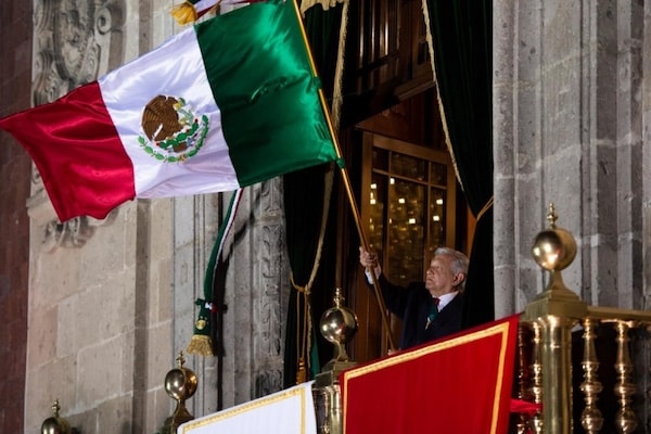 | Mexican President Andrés Manuel López Obrador waving the flag of Mexico Photo from Wikimedia Commons | MR Online