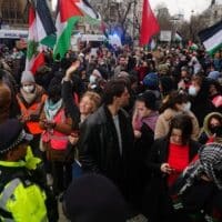 Metropolitan Police officers form a cordon at Parliament Square to prevent protesters reaching Westminster Bridge during a Free Palestine Coalition demonstration in central London, January 6, 2024