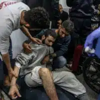 PALESTINIAN MEN WHO WERE ARRESTED DURING THE ISRAELI GROUND INVASION OF NORTHERN GAZA RECEIVE MEDICAL TREATMENT AFTER THEIR RELEASE AT AL-NAJJAR HOSPITAL IN RAFAH, DECEMBER 24, 2023. (PHOTO: © ABED RAHIM KHATIB/DPA VIA ZUMA PRESS/APA IMAGES)