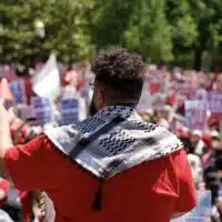 Mohammad, an organizer with PYM, addresses the crowd on June 8. Photo: PYM