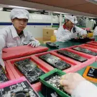 Companies in the Global North, like Apple, often outsource production to places like China in the Global South for cheap yet high-skilled labor.AP PHOTO/KIN CHEUNG