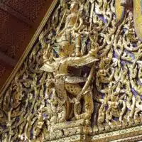 The Hindu god Narayana (or, Vishnu) on the back of a Garuda (the mount of Vishnu), depicted on one of the pediments in Wat Phra Si Rattana Satsadaram, the most sacred Buddhist temple in Thailand