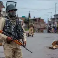 Indian soldiers enforce a curfew in Kashmir. (Photo by Yawar Nazir/ Getty Images)