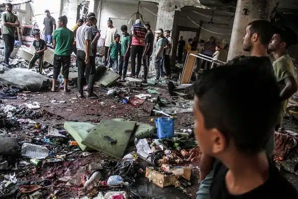 | Palestinians search for victims after an Israeli attack that killed more than 100 people at a school in Gaza City on 10 August Mahmoud Zaki UPI | MR Online