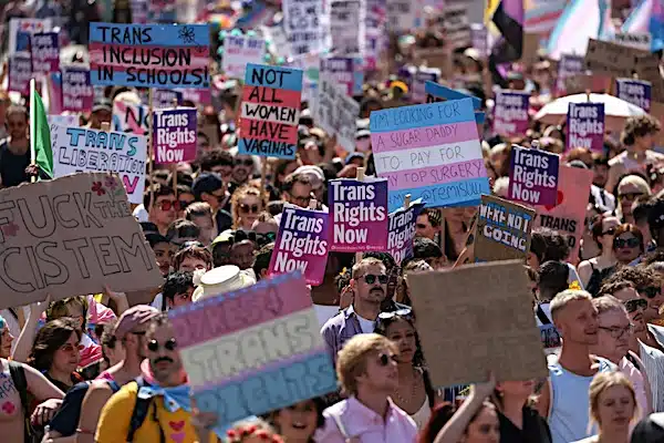 | Demonstrators hold placards during a London Trans Pride protest Photo by Hollie AdamsGetty Images | MR Online