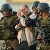 FARC leader Ricardo Palmera, better known as Simón Trinidad, brought to Bogota, Colombia after his capture in Ecuador, January 2004. Photo: Miguel Menéndez/EPA/Corbis/file photo.