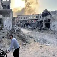 Smoke rises from a residential building folloiwng an Israeli strike in Beit Lahia, northern Gaza Strip, 1 November 2024 (AFP)