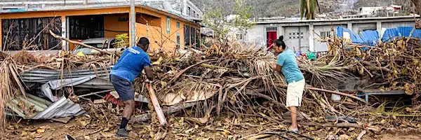 | Residents collect garbage and debris to burn in the town of Acoua after Cyclone Chido wreaked havoc on the French island territory of Mayotte on December 25 2024 Photo Patrick MeinhardtAFP via Getty Images | MR Online